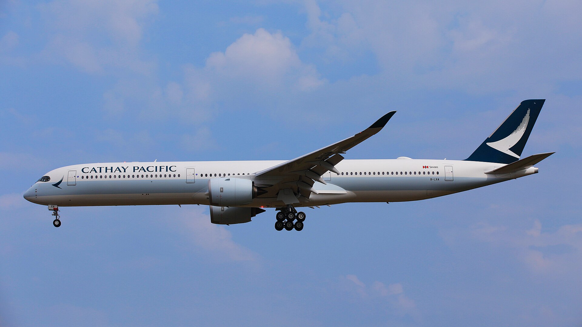 Cathay Pacific aircraft (CX) — OFW corridor carrier to Gulf states, photo via Wikimedia Commons (Wikipedia summary)